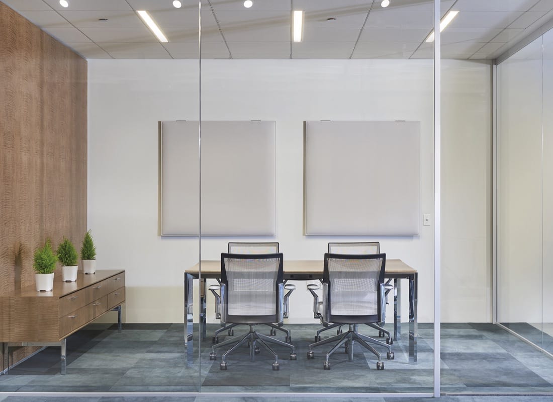 Snowsound Snowfix wall panels in a glass-walled meeting room