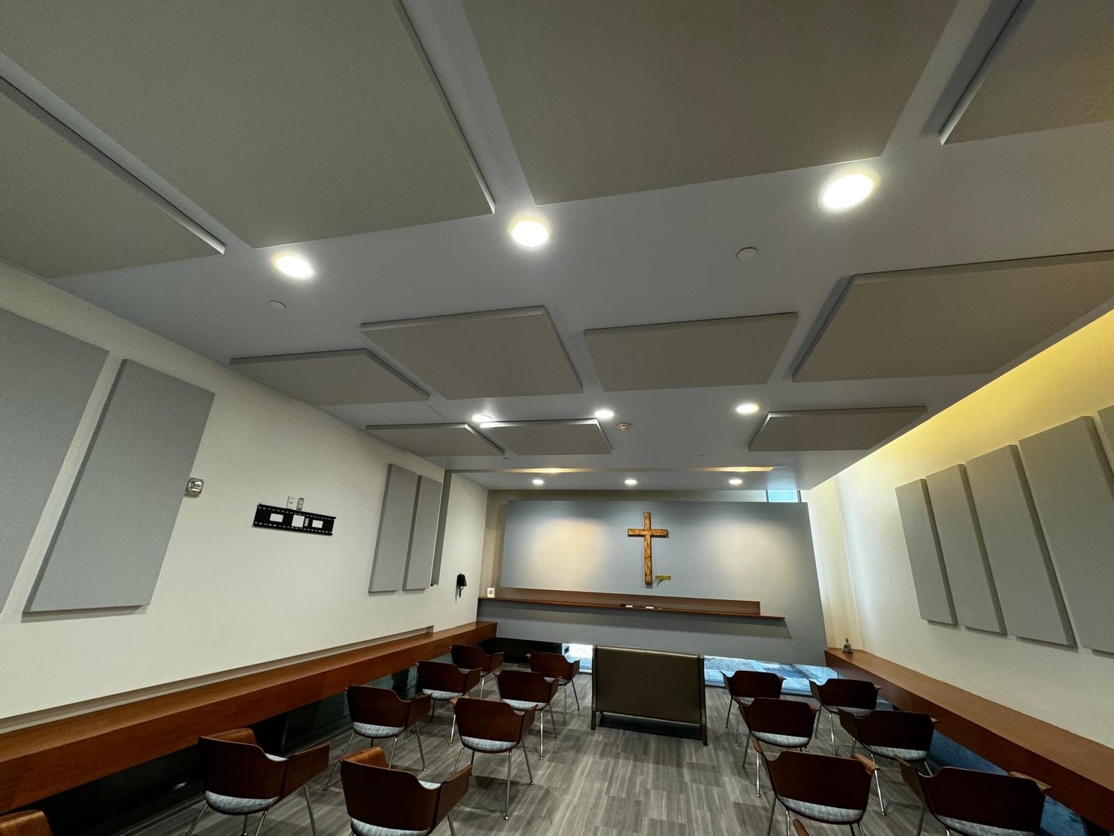 Chapel treated with wall panels and ceiling clouds